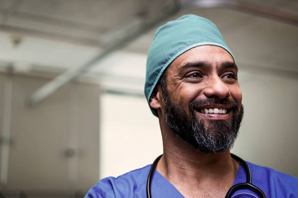 istock Thoughtful smiling doctor looking away in ward 904802298