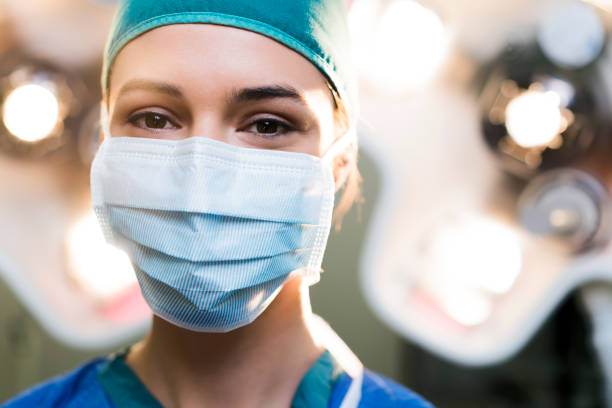 Surgeon wearing surgical mask in operating room