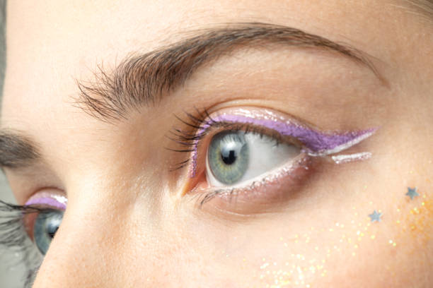 close up woman eyes with bright makeup