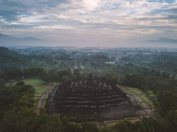 istock Aerial view of Borobudur temple in Java at sunrise, Indonesia 904805720