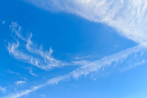 istock Sparse clouds in the blue sky morning background. Fluffy clouds in the blue sky evening background. Blue sky in summer background with tiny clouds, 904813616