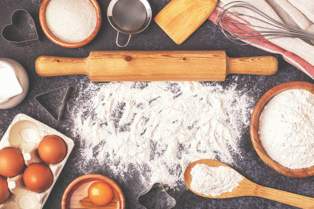 istock Ingredients for baking  - flour, wooden spoon, rolling pin, eggs. 904821446