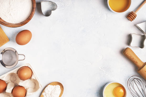 istock Ingredients for baking  - flour, wooden spoon, rolling pin, eggs. 904821772