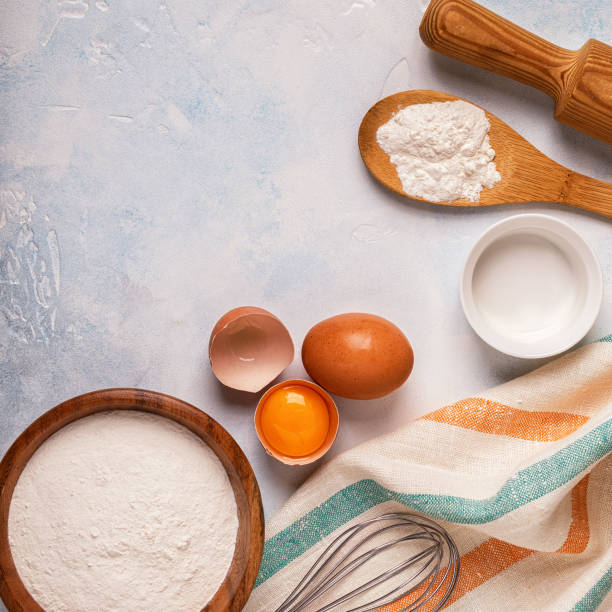 istock Ingredients for baking  - flour, wooden spoon, rolling pin, eggs. 904821826