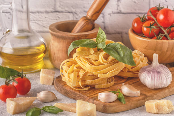 istock Products for cooking - pasta, tomatoes, garlic, olive oil, basil. 904822240