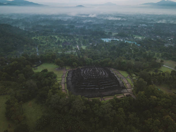 istock Aerial view of Borobudur temple in Java at sunrise, Indonesia 904825844