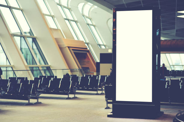 istock Blank empty digital billboard for your advertising on publicity content in airport waiting hall. Mock up electronic media board with copy space for your design information in terminal interior 904830014