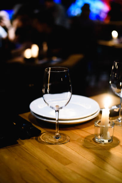 istock Empty glass on table in night club or restaurant, closeup 904836742