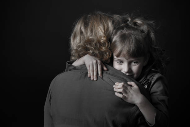 istock Girl hugging mother. 904848358