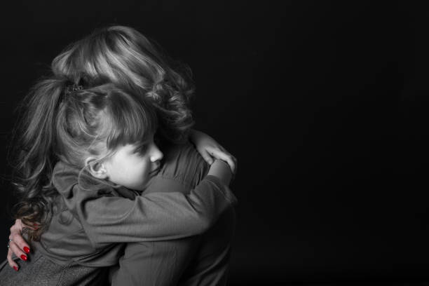 istock Girl hugging mother. 904848384