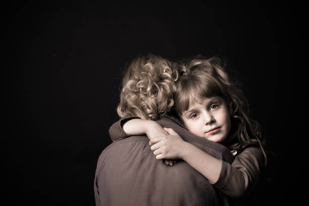 istock Girl hugging mother. 904848388