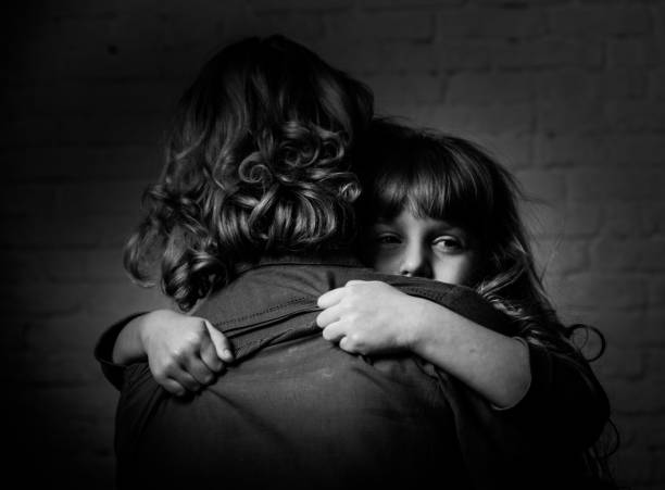 istock Girl hugging mother. 904848390