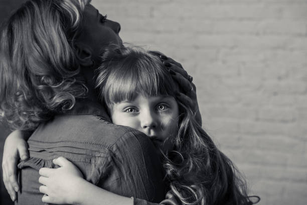 istock Girl hugging mother. 904848408