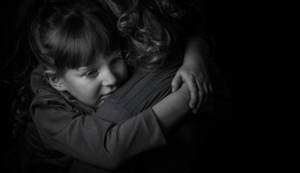 istock Girl hugging mother. 904848428