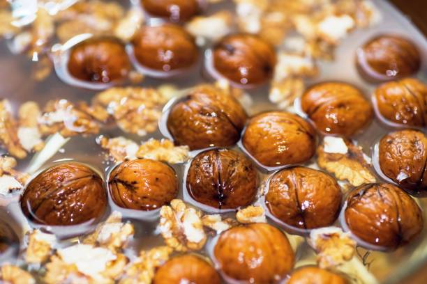 walnuts in water. - noz imagens e fotografias de stock