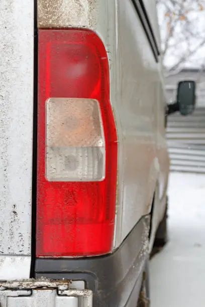 Photo of Dirty track tail light. Car in winter