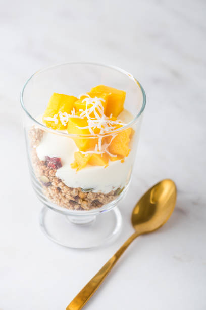 istock Mango coconut granola yoghurt dessert 904849560
