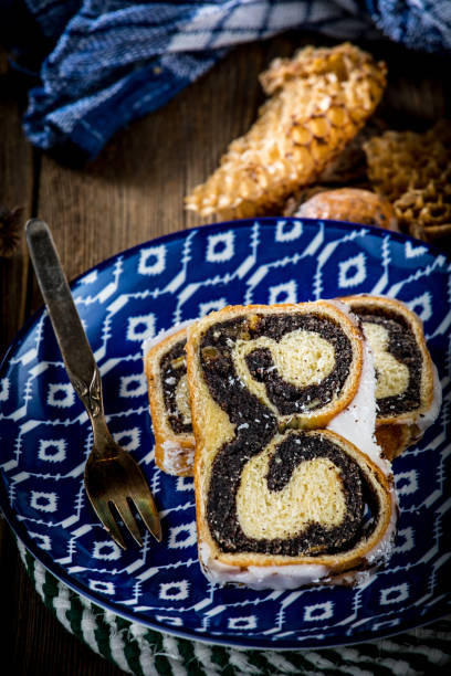 istock Two pieces of poppie-seed cake on a plate. 904849896