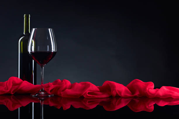 istock Glass and bottle of red wine. 904852810