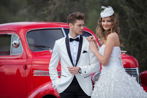 young elegance newlywed couple at the retro car - haute couture beautiful smoking beauty imagens e fotografias de stock