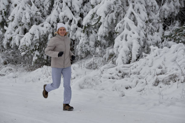 istock running in a white cap in the winter 904855740
