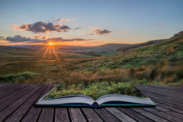 Stunning landscape image of Stanage Edge during Summer sunset in Peak District Egland