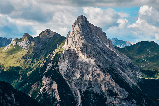 A rocky mountain peak with hiking trails next to the Marmolada Glacier  in the Trentino Dolomites, Italy