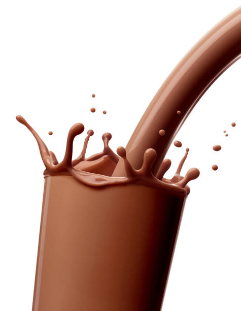 istock chocolate milk drink splash glass straw 904856604