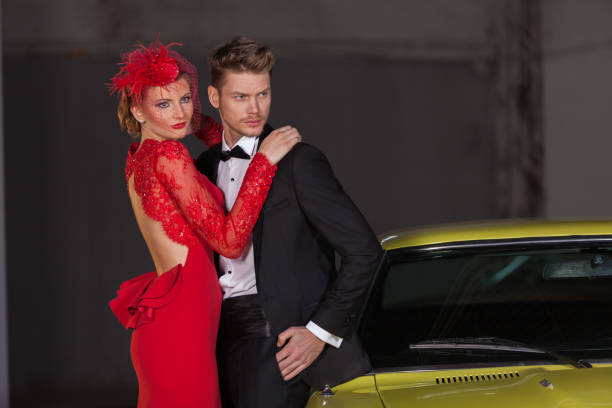 young elegance couple at the garage with her retro car - haute couture beautiful smoking beauty imagens e fotografias de stock