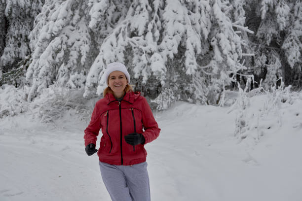 istock people running in the snow 904857238