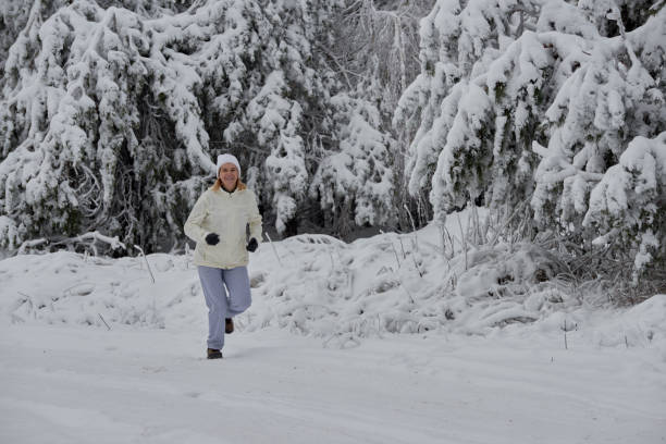 istock people running in the snow 904857666