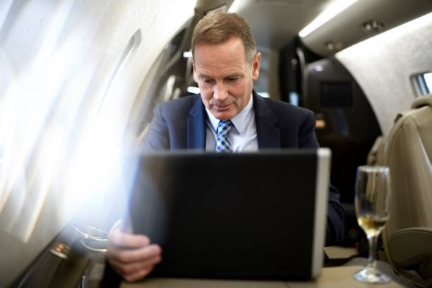 istock Man in private jet airplane 904860398