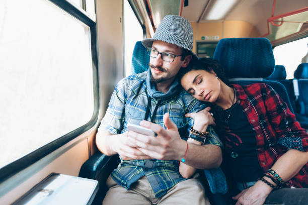 istock Couple traveling with train 904860508