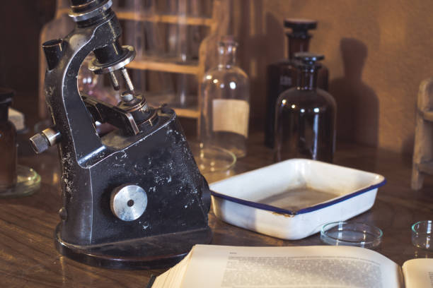 istock Antique laboratory, microscope and glass tubes 904860778