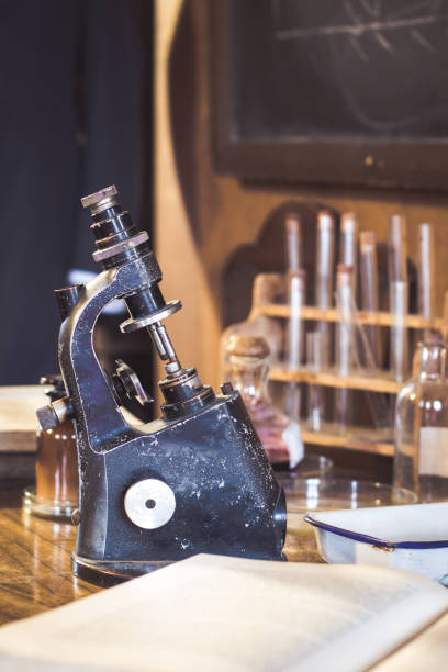 istock Antique laboratory, microscope and glass tubes 904860888