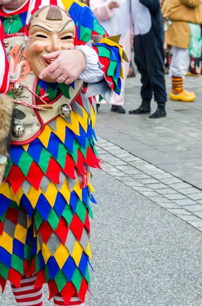 Participants in costumes perform a street procession Carneval Fasnacht in the city of Lahr, Germany. Traditionally, the festive and cultural carnival procession through the streets of cities and towns in Germany