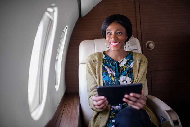 istock Woman in private jet airplane 904864506