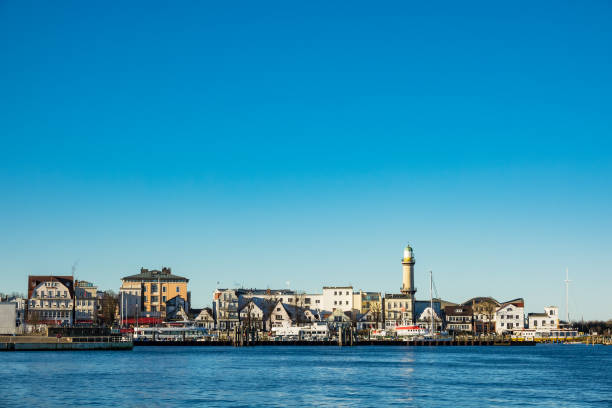 istock Buildings, lighthouse and blue sky in Warnemuende 904864852