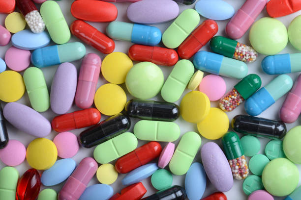 istock Pharmacy theme. Multicolored Isolated Pills and Capsules 904872400