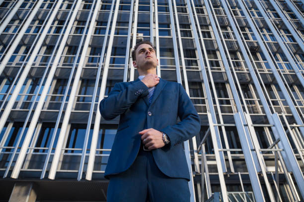 istock Confident businessman on urban background 904876542