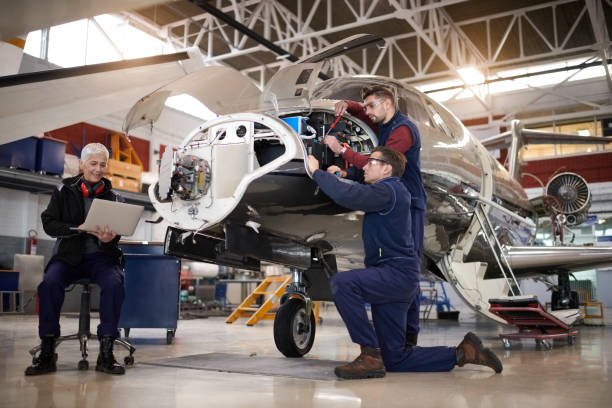 Aircraft mechanics in the hangar stock photo