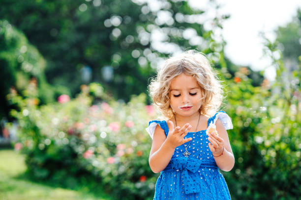 istock little girl eating ice cream 904880824
