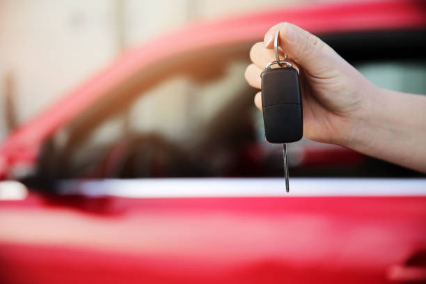 istock Hand holding keys to new car 904881800
