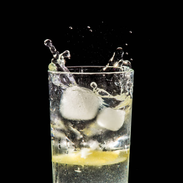istock water splash with lemon and ice on black 904884682