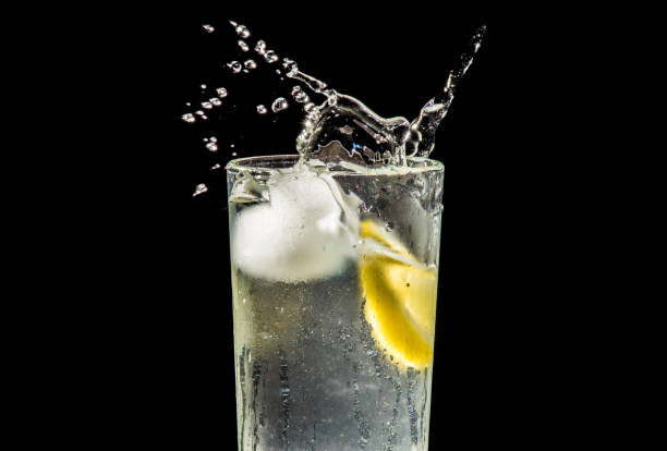 istock water splash with lemon and ice on black 904886952