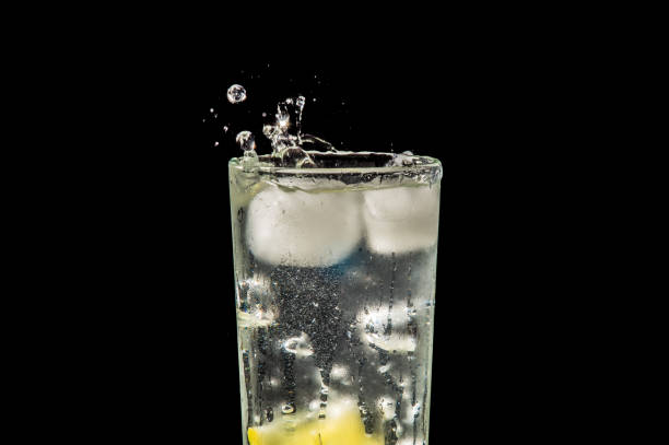 istock water splash with lemon and ice on black 904887444