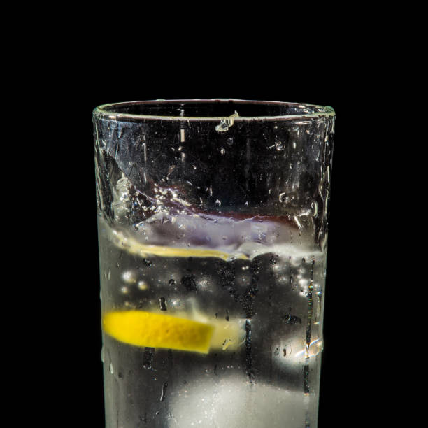 istock water splash with lemon and ice on black 904890570