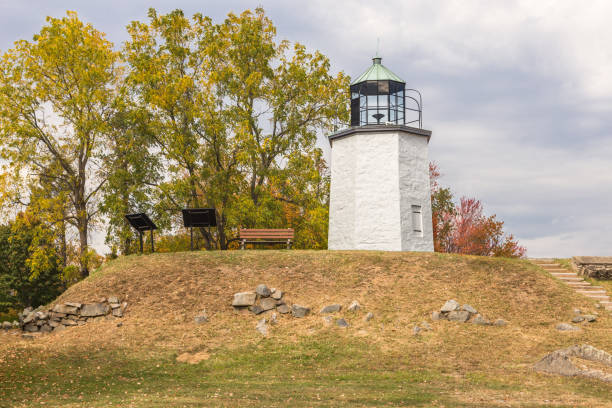 istock Stony Point Lighthouse with Trees in Autumn Colors (Foliage), Rocks and Cloudy Sky, Stony Point Battlefield State Historic Site, Hudson Valley, New York. 904890982