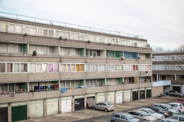 Communal car park next to a council block in south east London London, UK - December 9. 2017 - Communal car park next to a council block in south east London neighborhood crime watch stock pictures, royalty-free photos & images