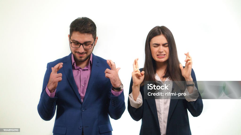 Office staff pray for the success of their chief in elections supporting him in this way Signs attracting good luck sincere interest in the work of office staff Fingers Crossed Stock Photo